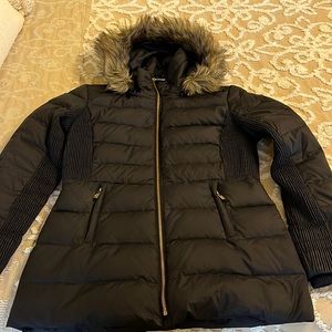 Woman’s black Michael Kors coat